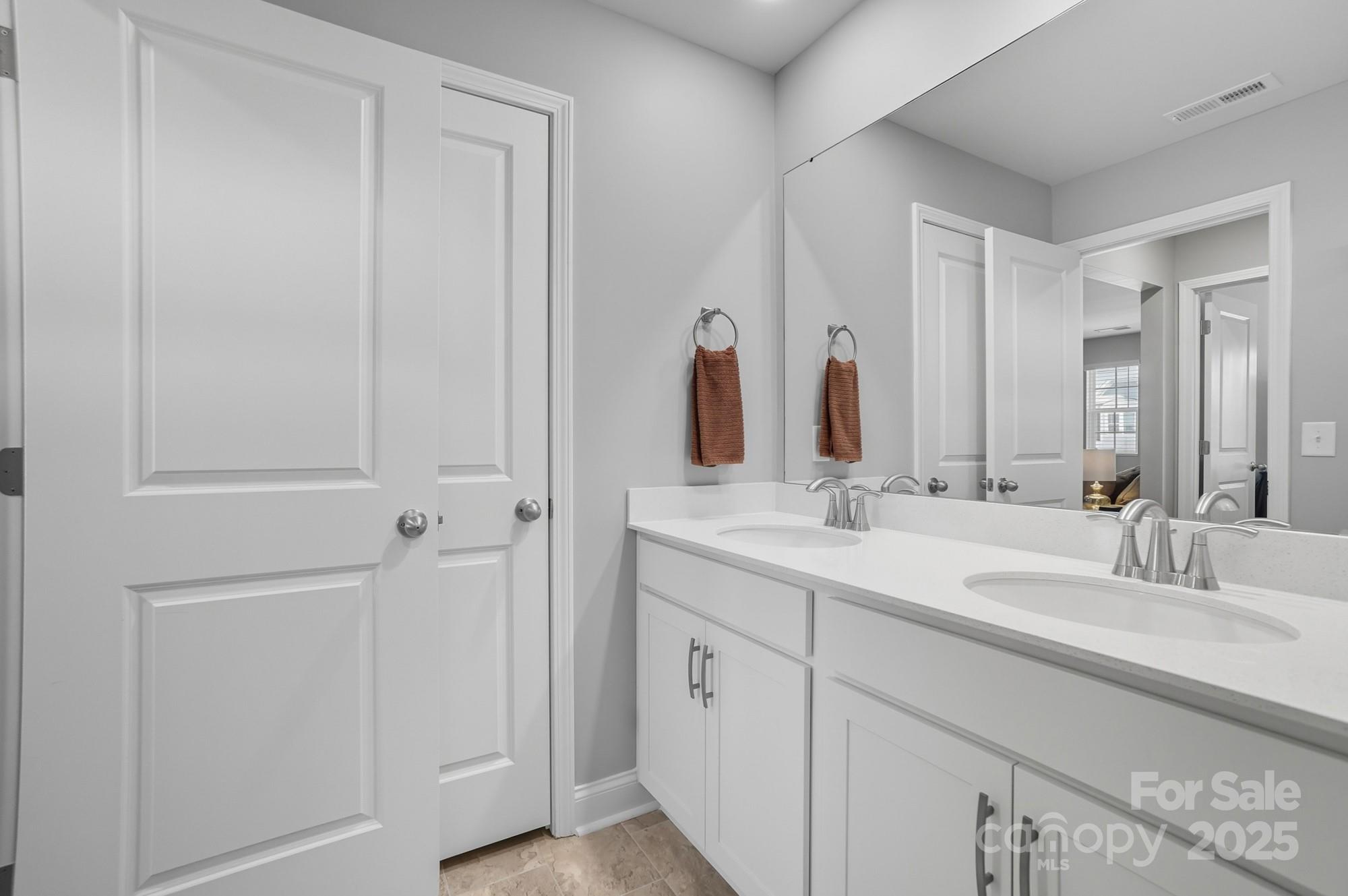 1325 Black Walnut Street Monroe, NC 28112 - Photo 36 of 46 a bathroom with a double vanity sink and a mirror