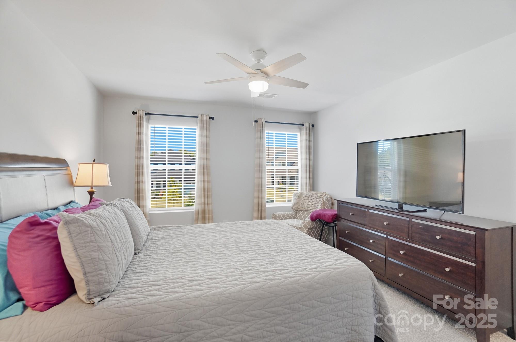 1325 Black Walnut Street Monroe, NC 28112 - Photo 40 of 46 a bedroom with a bed and a flat screen tv