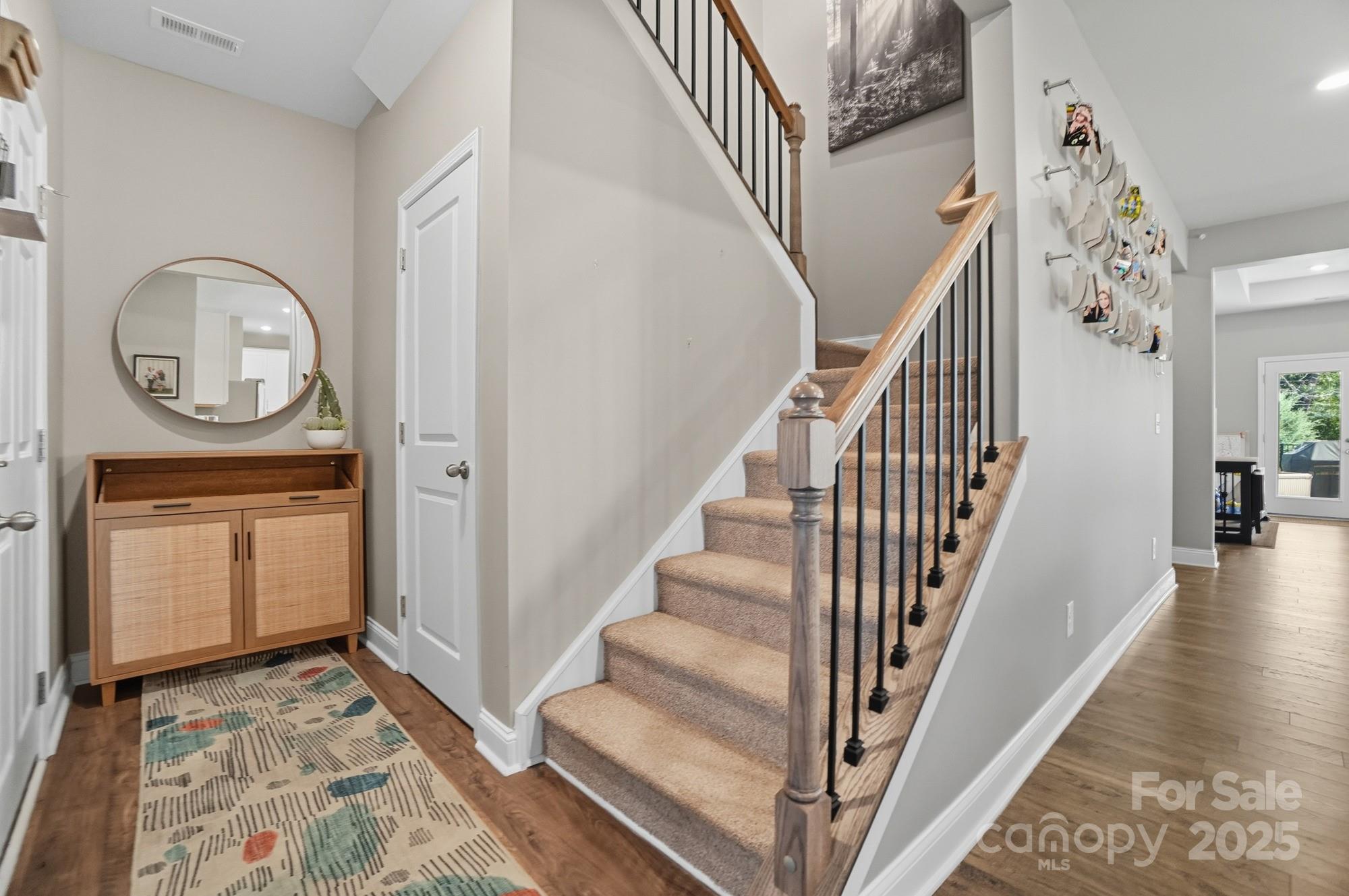 1325 Black Walnut Street Monroe, NC 28112 - Photo 9 of 46 a view of a hallway with wooden floor and workspace