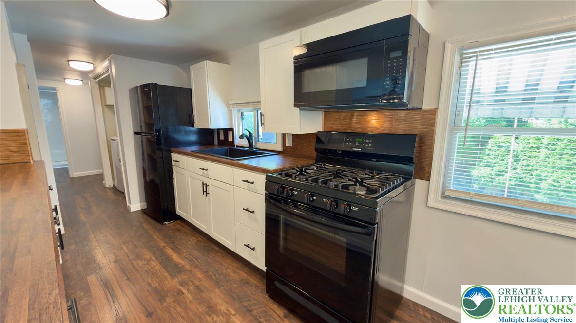 246 Poplar Street Bath, PA 18014 - Photo 19 of 34 A well-equipped galley kitchen offers modern appliances and ample counter space.