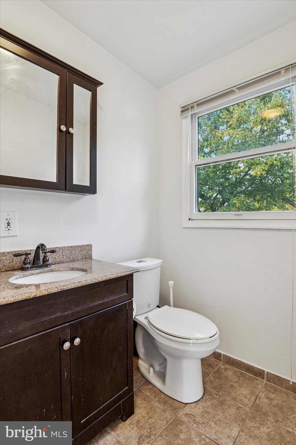 206 Decalb Avenue Wilmington, DE 19804 - Photo 11 of 14 a bathroom with a granite countertop toilet sink and mirror