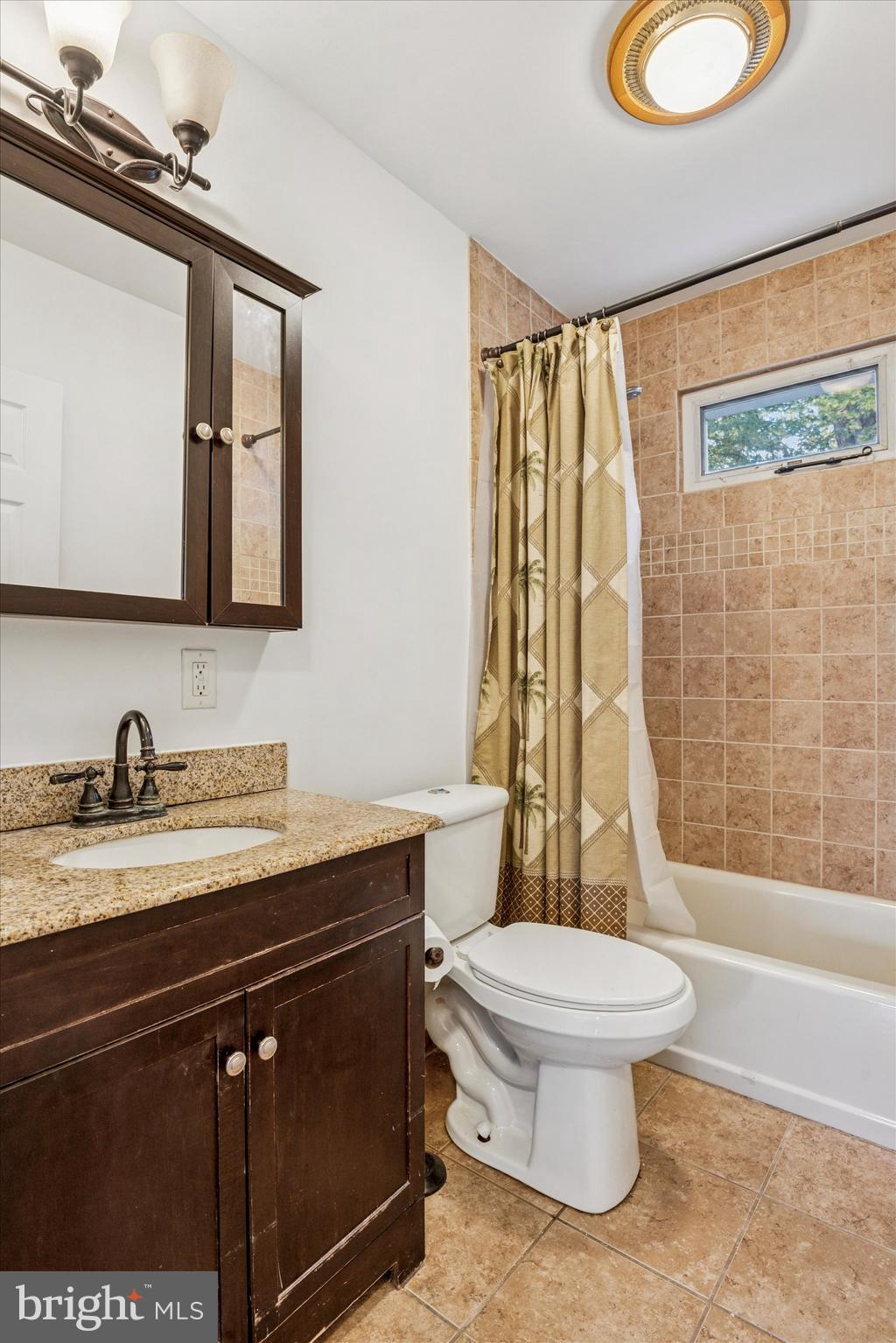 206 Decalb Avenue Wilmington, DE 19804 - Photo 5 of 14 a bathroom with a granite countertop sink toilet a mirror and shower