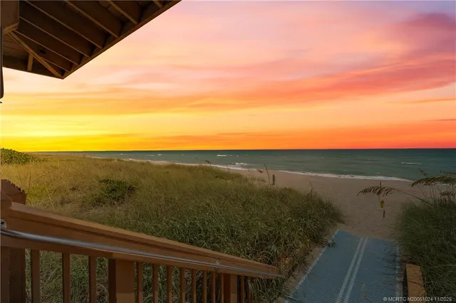 a view of a balcony with an ocean view