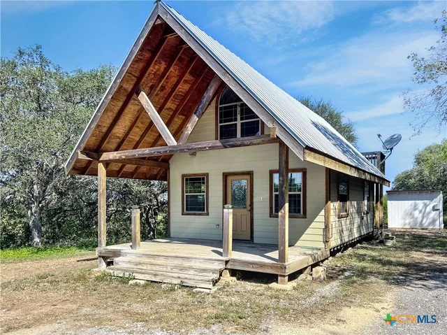 a front view of a house with a porch