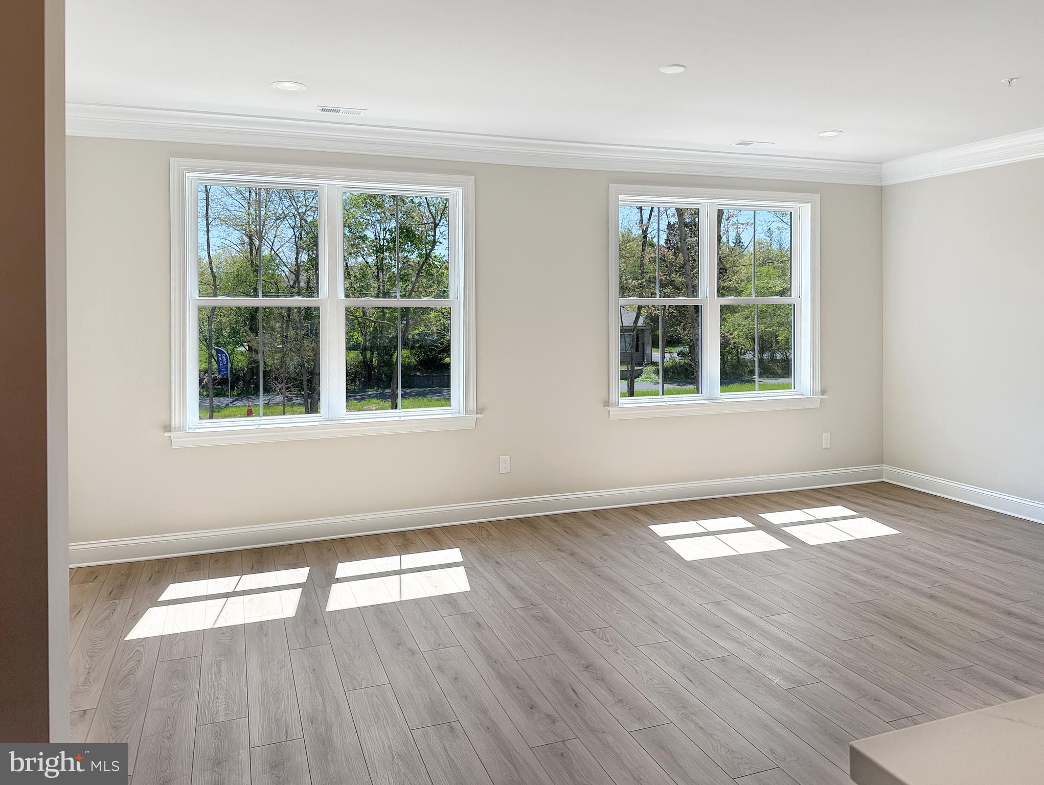 14 Schadle Road Perkasie, PA 18944 - Photo 20 of 44 an empty room with wooden floor and windows