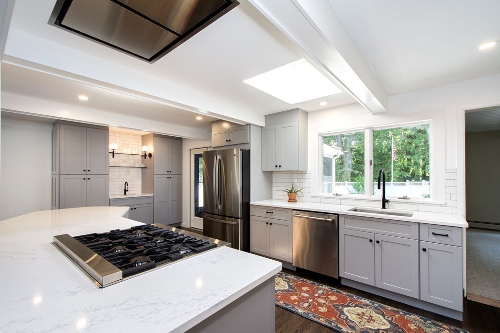 18 Liberty Pole Road Hingham, MA 02043 - Photo 12 of 37 a kitchen with a sink stove and refrigerator