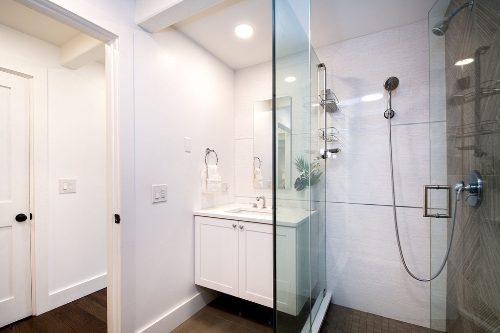 18 Liberty Pole Road Hingham, MA 02043 - Photo 22 of 37 a bathroom with a shower and a sink