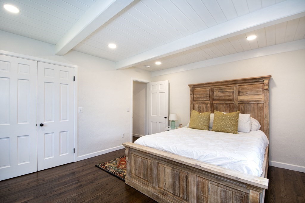 18 Liberty Pole Road Hingham, MA 02043 - Photo 25 of 37 a bedroom with a large bed and wooden floor