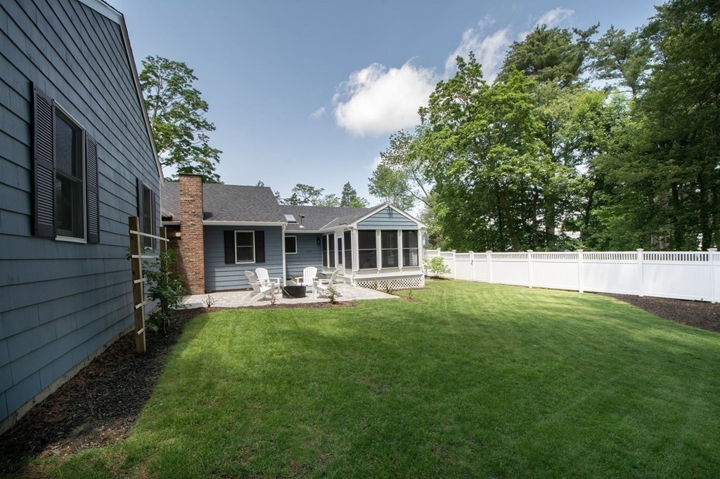 18 Liberty Pole Road Hingham, MA 02043 - Photo 34 of 37 a front view of a house with patio and garden