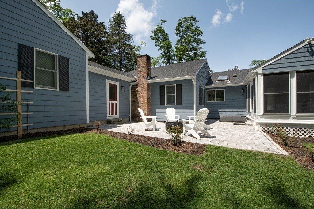 18 Liberty Pole Road Hingham, MA 02043 - Photo 35 of 37 a view of a house with backyard and porch