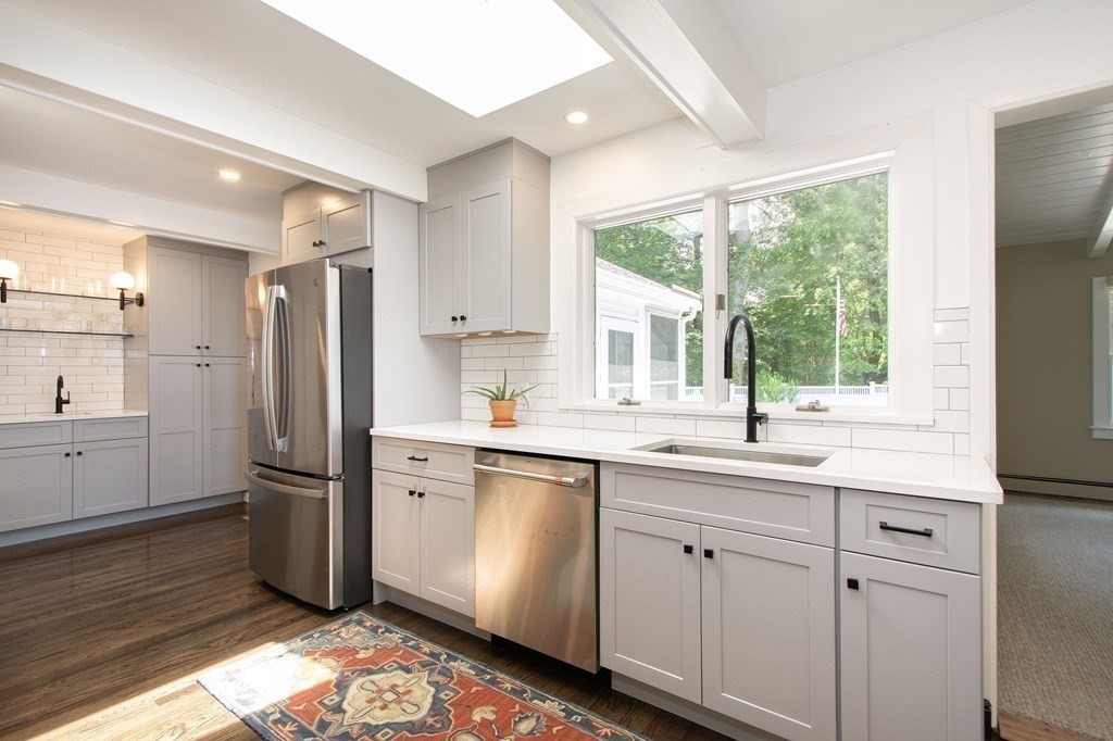 18 Liberty Pole Road Hingham, MA 02043 - Photo 7 of 37 a kitchen with a sink window and refrigerator