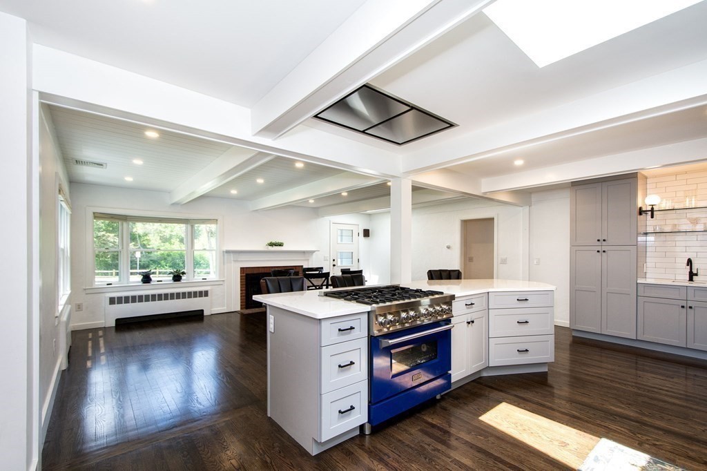 18 Liberty Pole Road Hingham, MA 02043 - Photo 9 of 37 a kitchen with stainless steel appliances a stove and wooden floor
