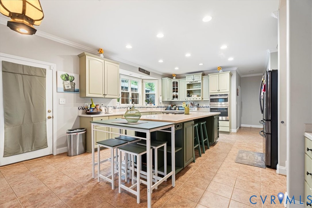 28 Millbrook Road Stafford, VA 22554 - Photo 16 of 44 a kitchen with stainless steel appliances granite countertop a stove top oven a sink a refrigerator and white cabinets