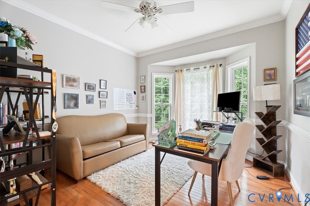 28 Millbrook Road Stafford, VA 22554 - Photo 22 of 44 a living room with furniture a flat screen tv and a floor to ceiling window
