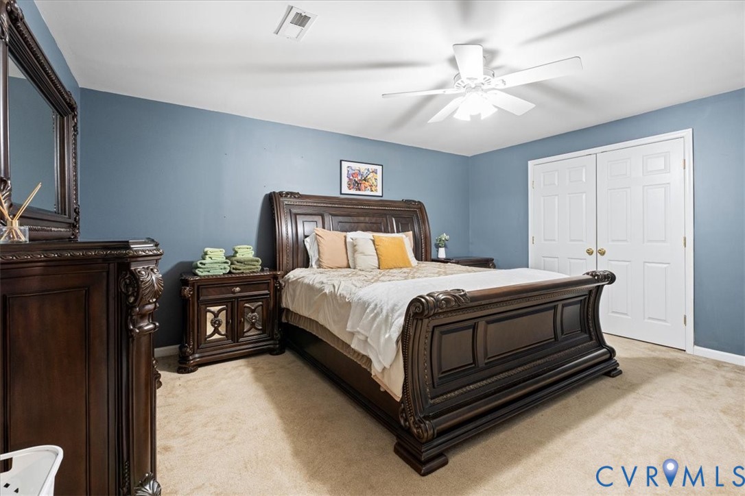 28 Millbrook Road Stafford, VA 22554 - Photo 25 of 44 a bedroom with a bed and a chandelier