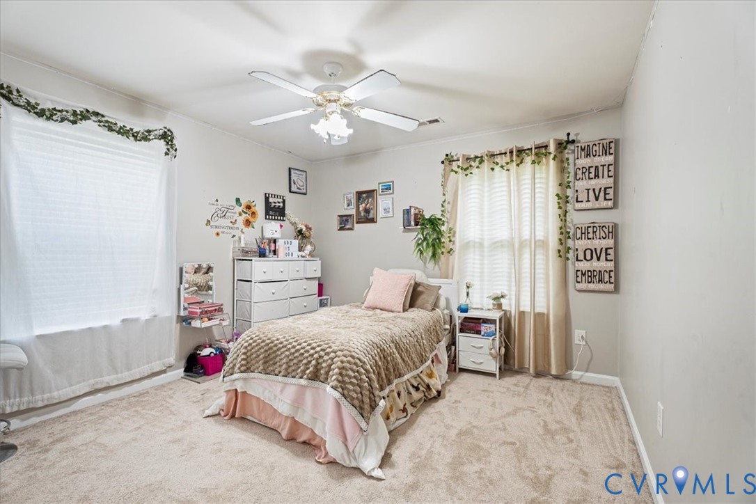 28 Millbrook Road Stafford, VA 22554 - Photo 31 of 44 a bedroom with a bed and a chandelier