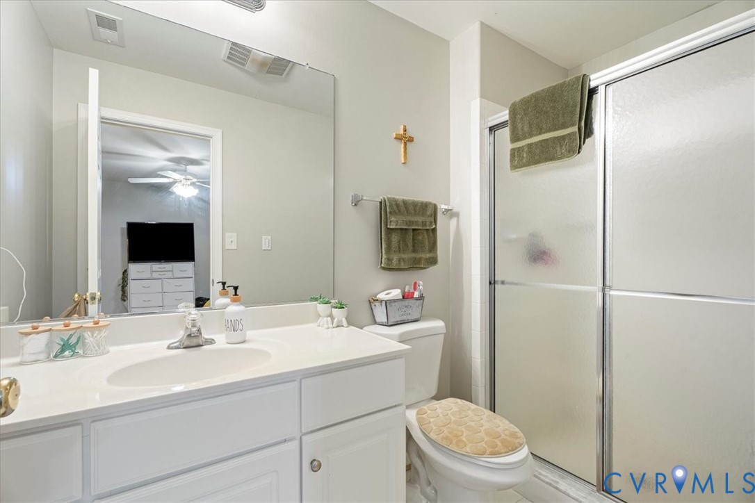28 Millbrook Road Stafford, VA 22554 - Photo 34 of 44 a bathroom with a sink toilet a mirror and shower