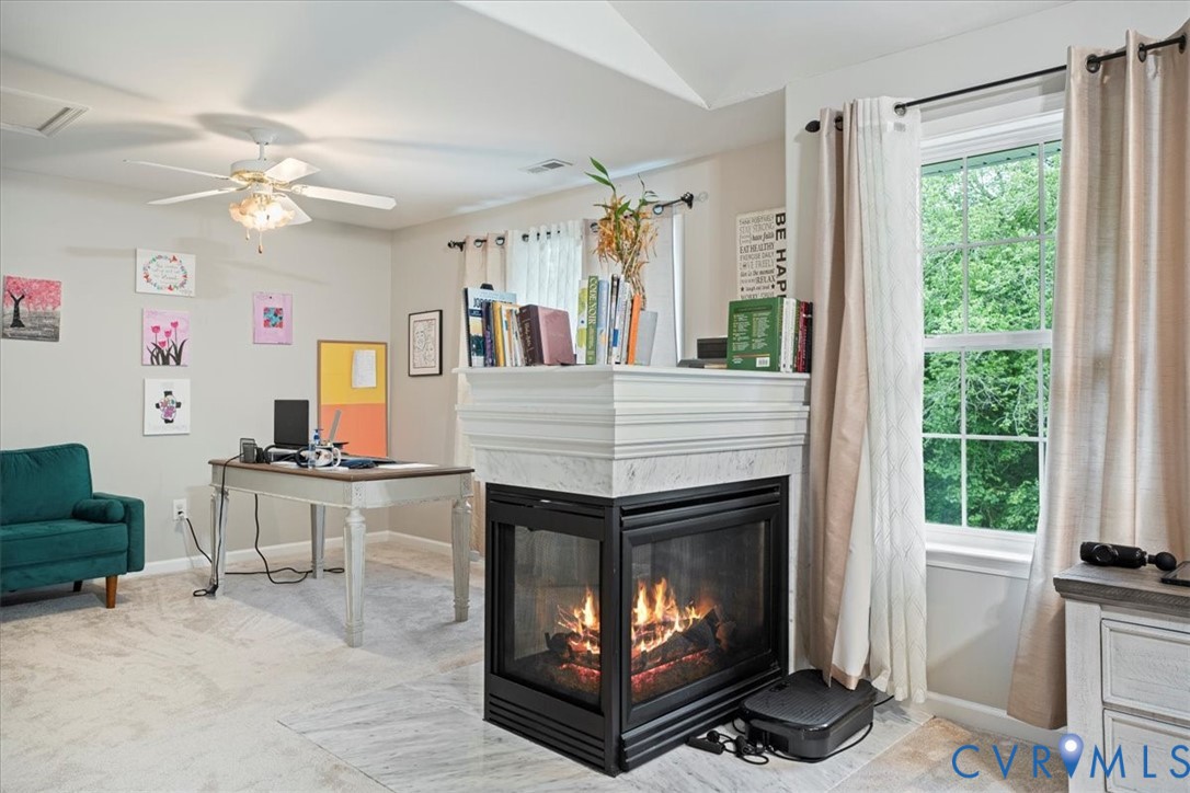 28 Millbrook Road Stafford, VA 22554 - Photo 36 of 44 a living room with furniture a flat screen tv and a fireplace