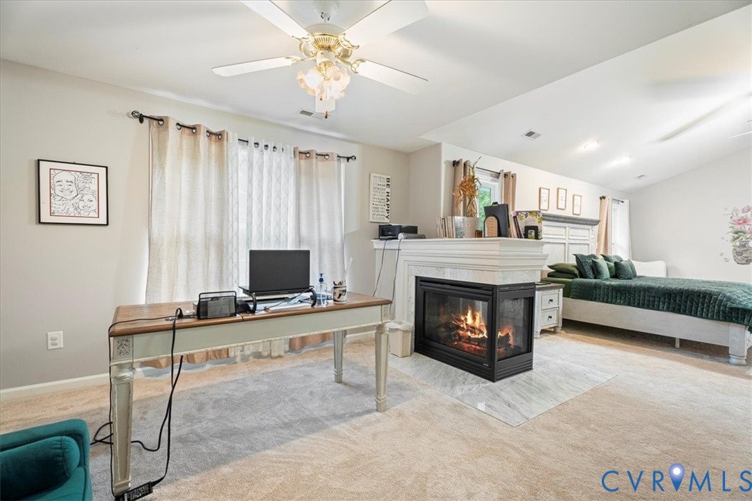 28 Millbrook Road Stafford, VA 22554 - Photo 37 of 44 a living room with furniture a fireplace and a flat screen tv