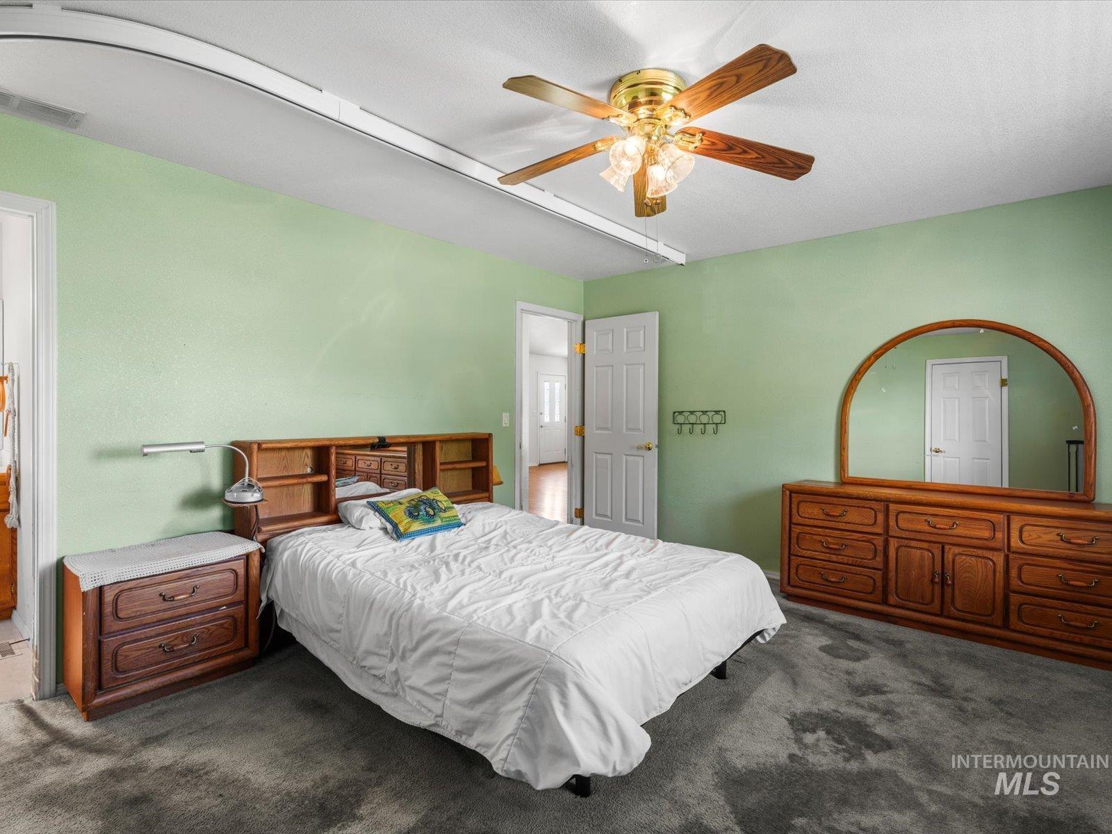 3540 Wills Road Emmett, ID 83617 - Photo 17 of 36 Bedroom featuring textured green walls and gray carpet