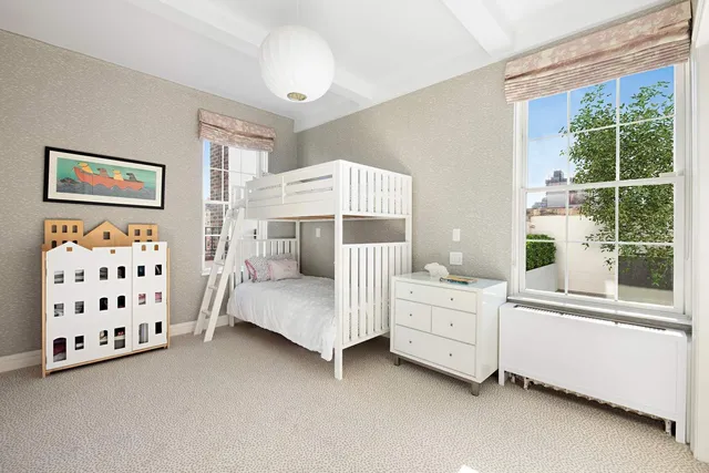 a bathroom with a granite countertop sink a large mirror a bathtub and next to a window