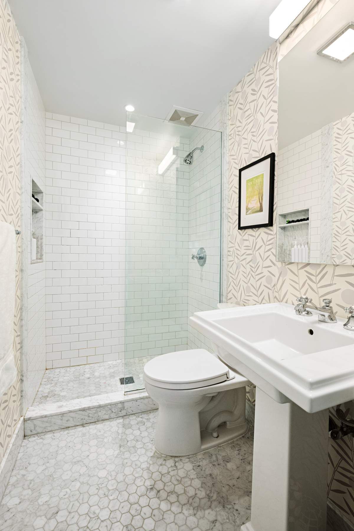 9 East 96th Street, Unit PH Manhattan, NY 10128 - Photo 17 of 18 a bathroom with a sink toilet and shower