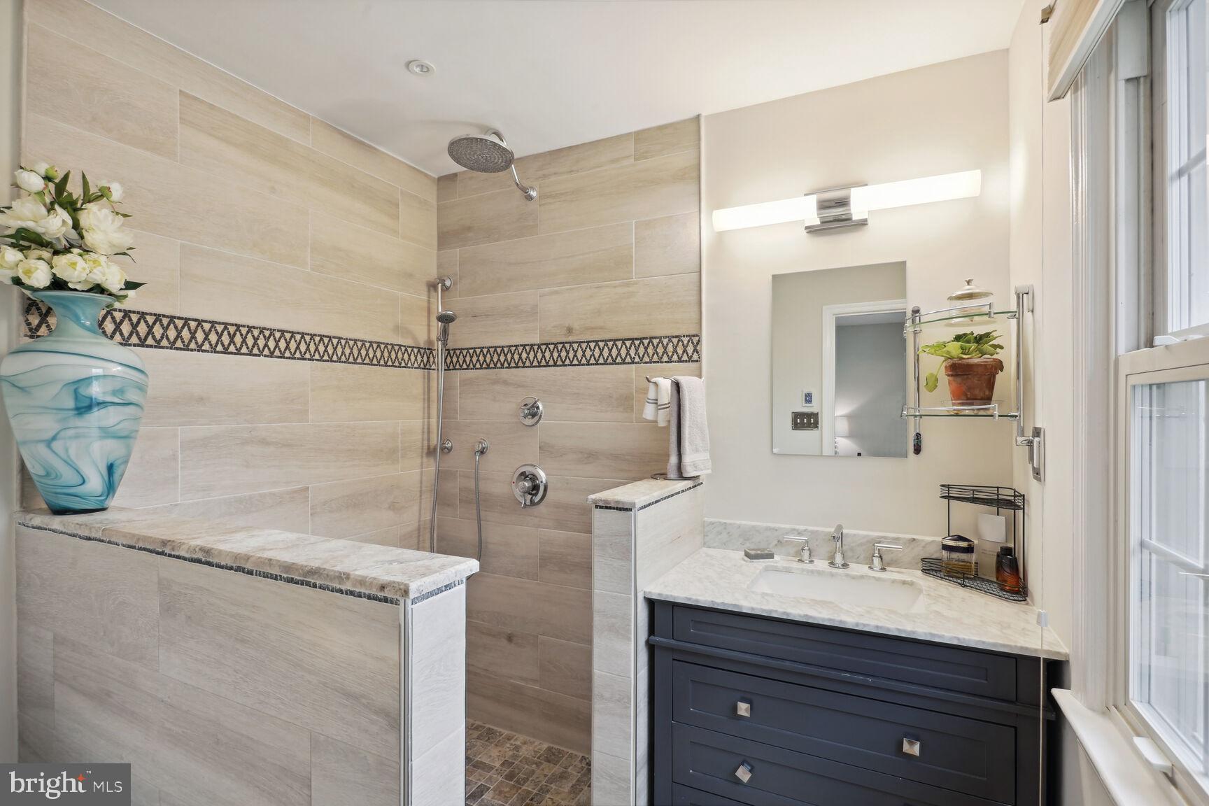 8092 Sleepy View Lane Springfield, VA 22153 - Photo 15 of 20 Luxurious owner's bath with custom walk in shower