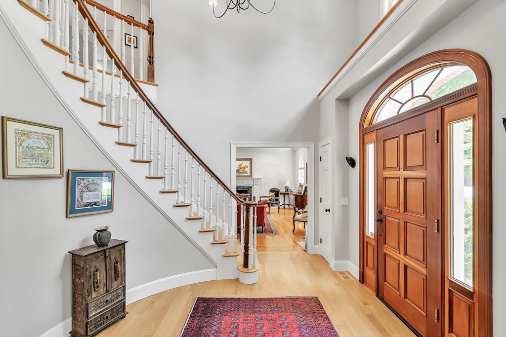 34 Solomon Pierce Road Lexington, MA 02420 - Photo 3 of 42 a view of an entryway with wooden floor and stairs