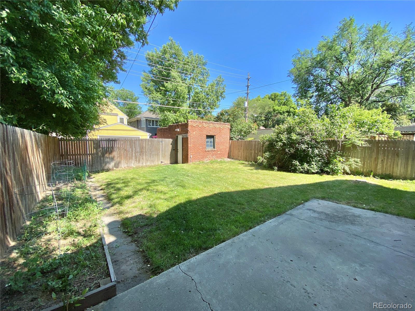 1146 Jackson Street Denver, CO 80206 - Photo 11 of 11 a view of a house with a yard