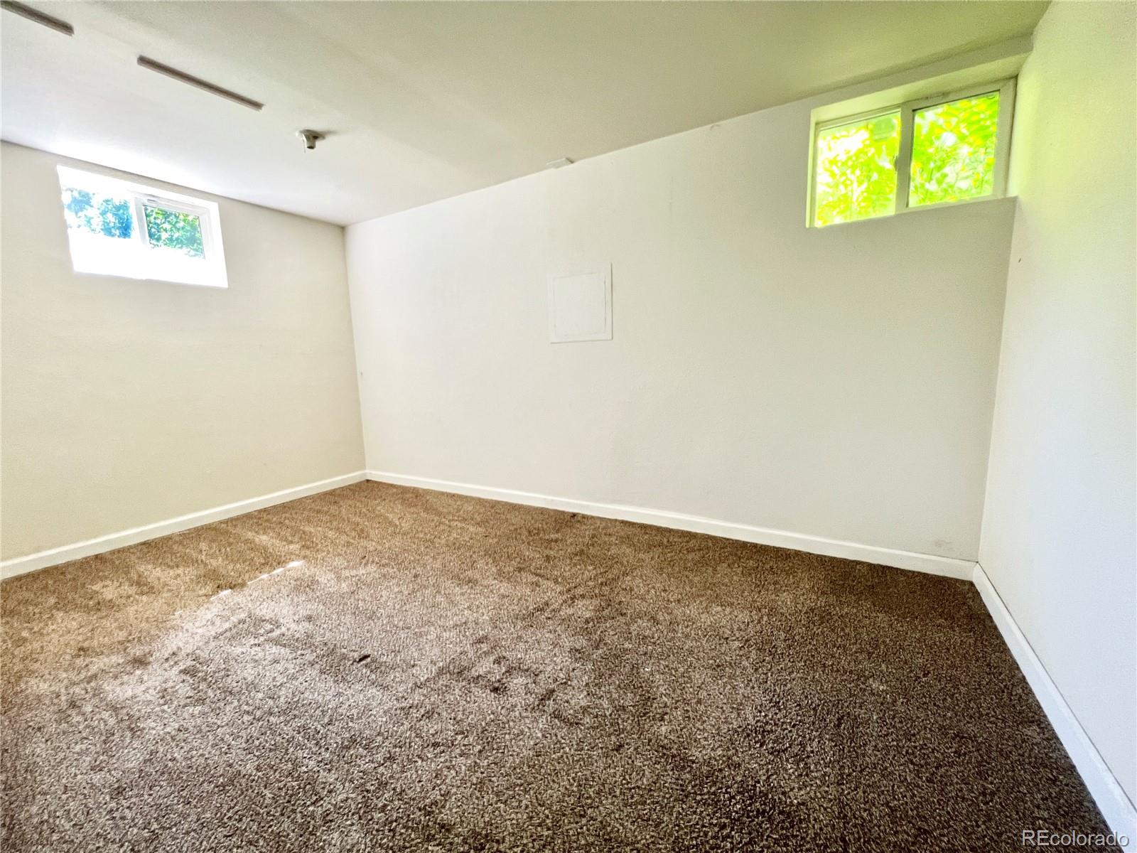 1146 Jackson Street Denver, CO 80206 - Photo 7 of 11 an empty room with a window