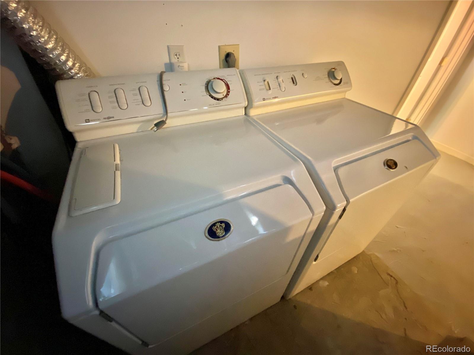 1146 Jackson Street Denver, CO 80206 - Photo 9 of 11 a utility room with dryer and washer