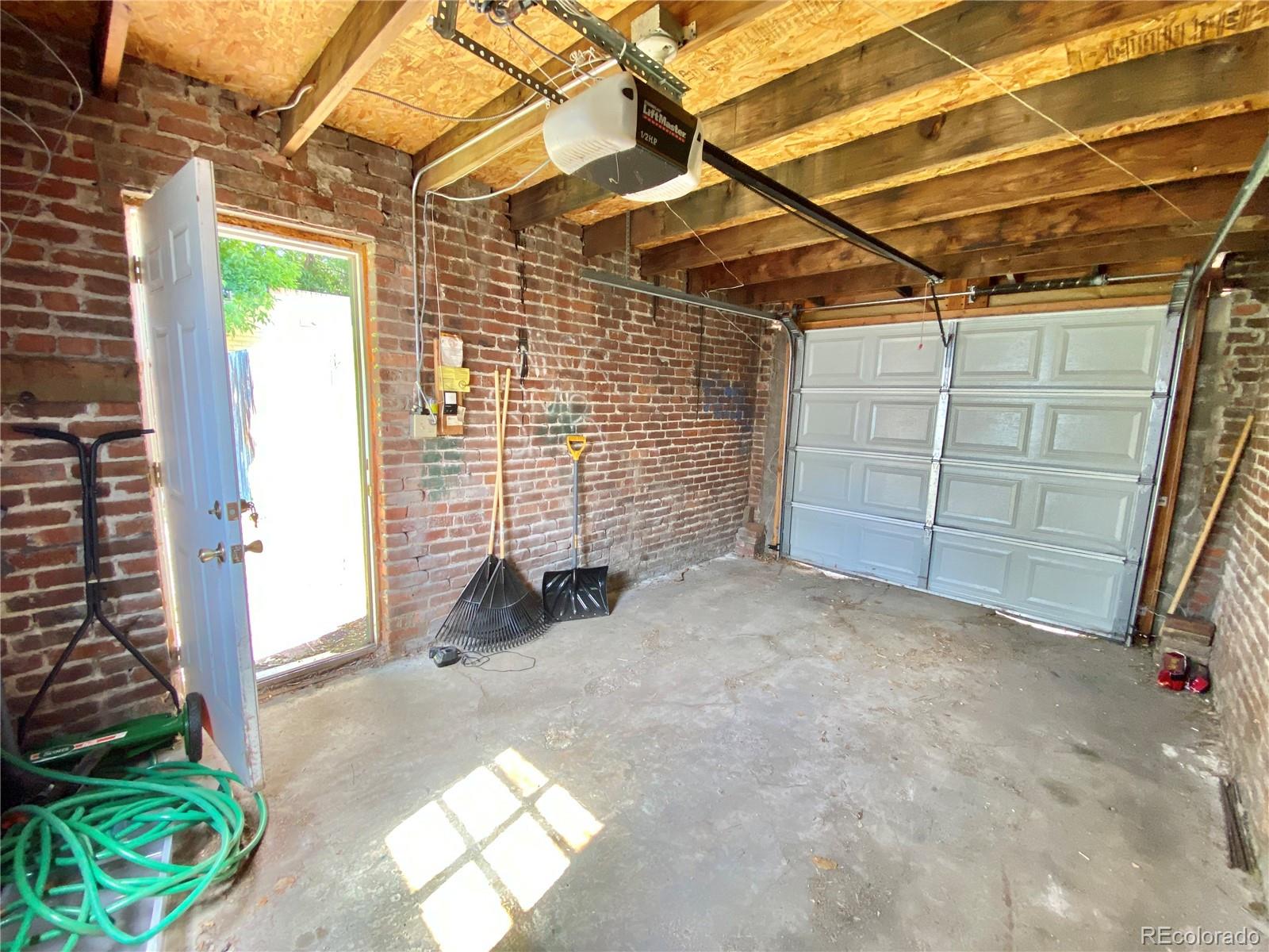1146 Jackson Street Denver, CO 80206 - Photo 10 of 11 a view of a room with wooden walls and stairs