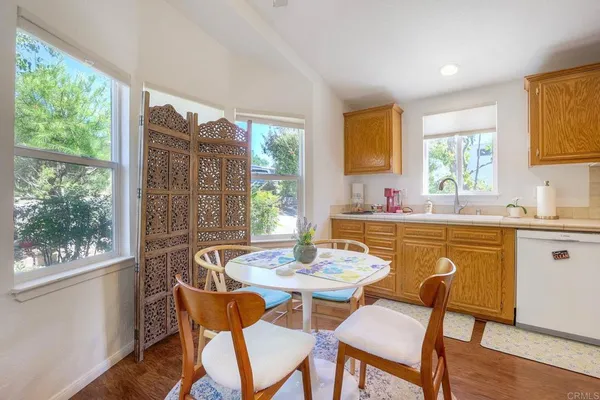 a dining room with furniture and window
