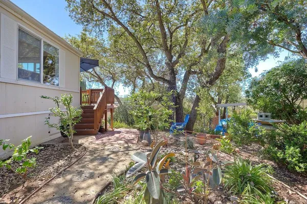 a backyard of a house with lots of green space