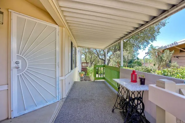 a balcony view with a seating space