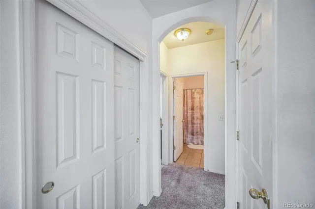 a view of a hallway with windows