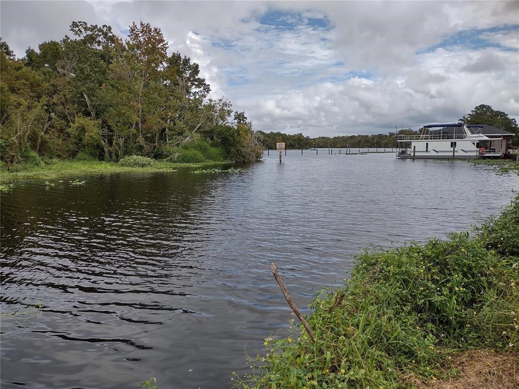 a view of a lake with houses in the back