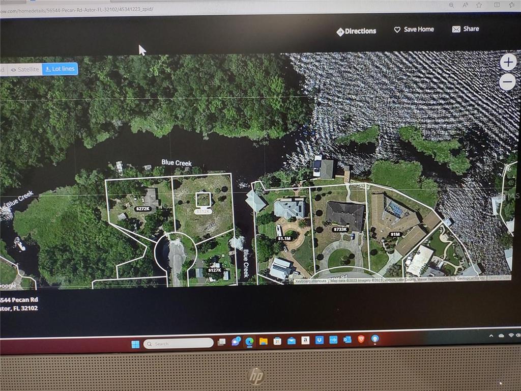56544 Pecan Road Astor, FL 32102 - Photo 11 of 18 an aerial view of a yard
