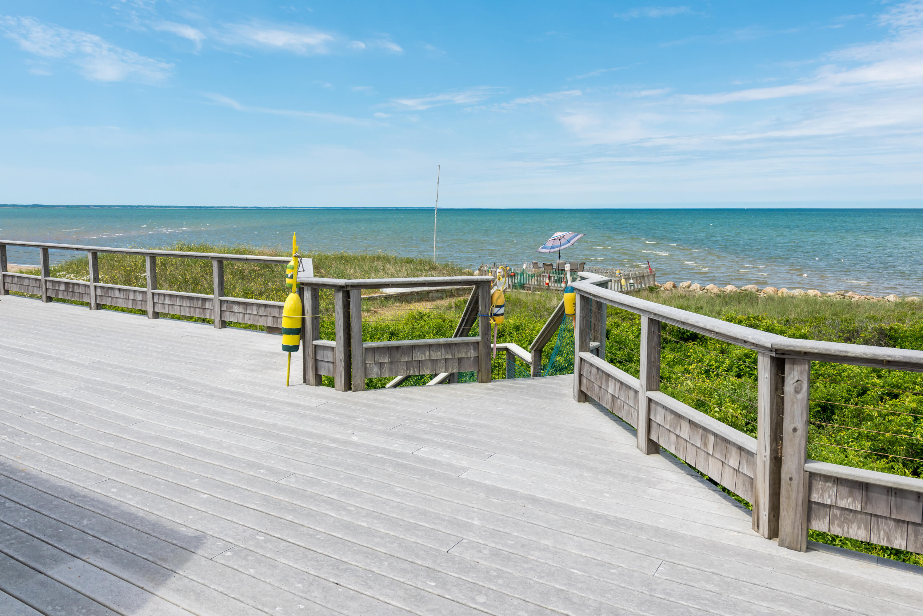 85 Sparrow Road Eastham, MA 02642 - Photo 16 of 43 a view of a balcony with an ocean