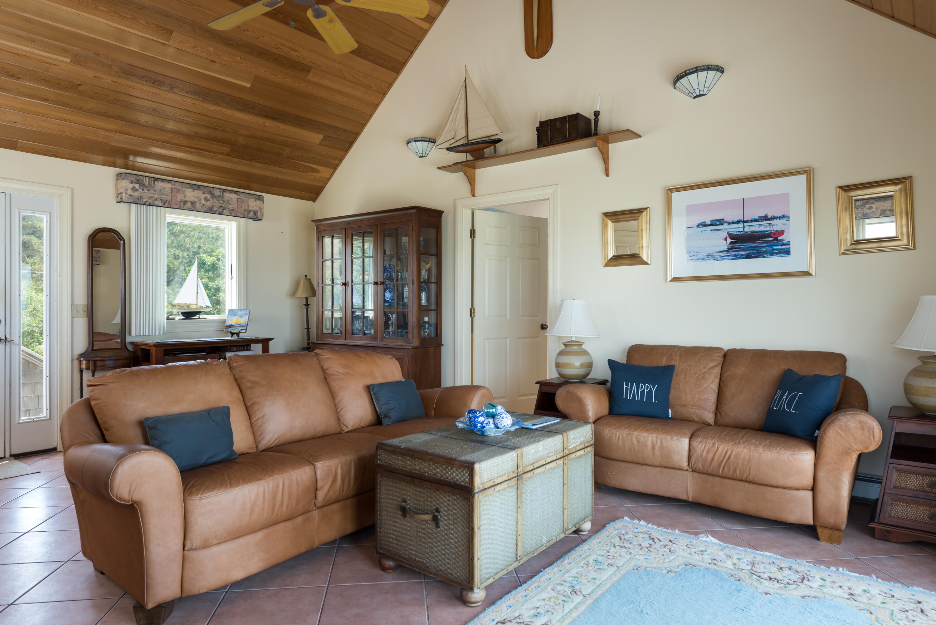 85 Sparrow Road Eastham, MA 02642 - Photo 17 of 43 a living room with furniture and a chandelier