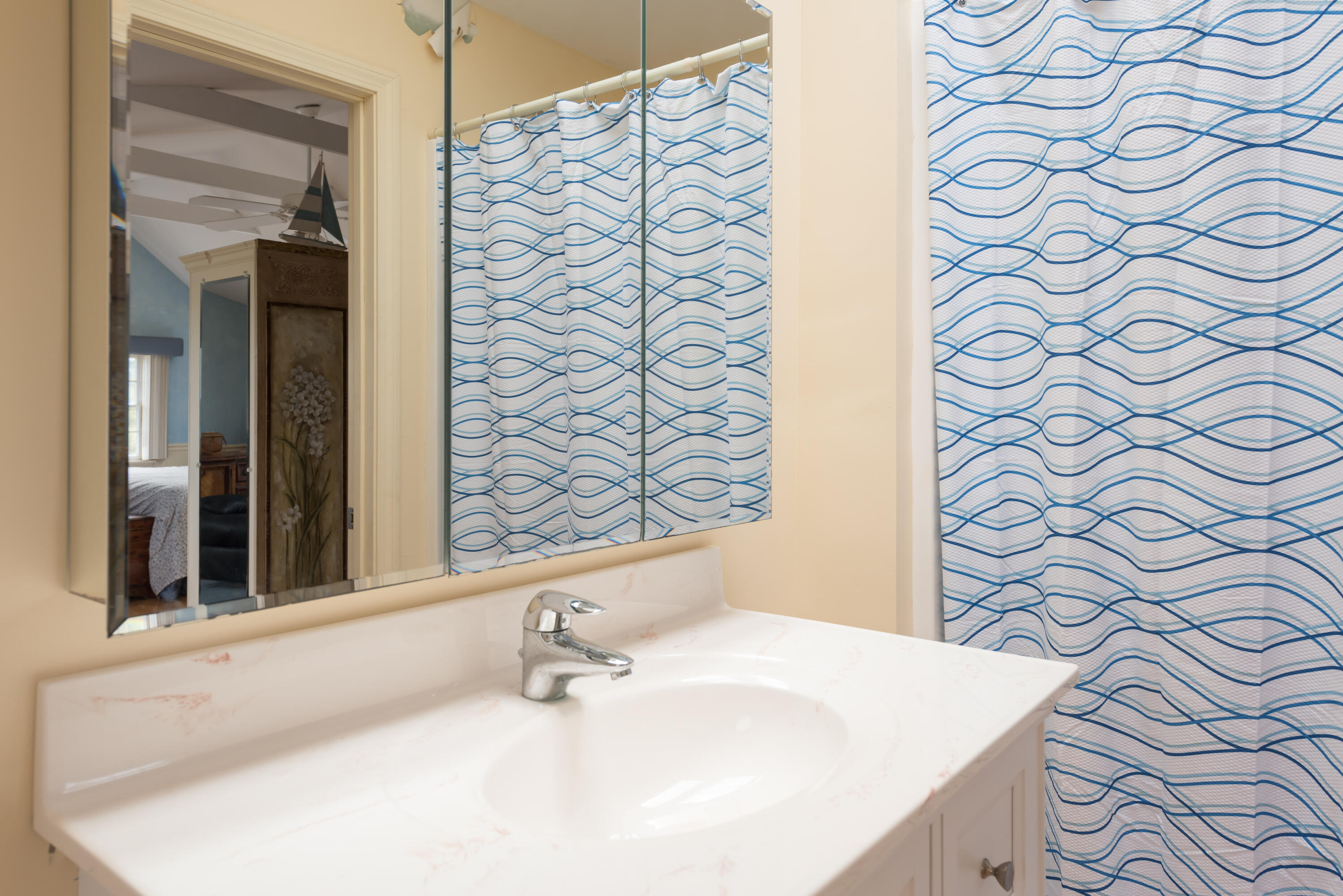 85 Sparrow Road Eastham, MA 02642 - Photo 20 of 43 a bathroom with a sink and a mirror