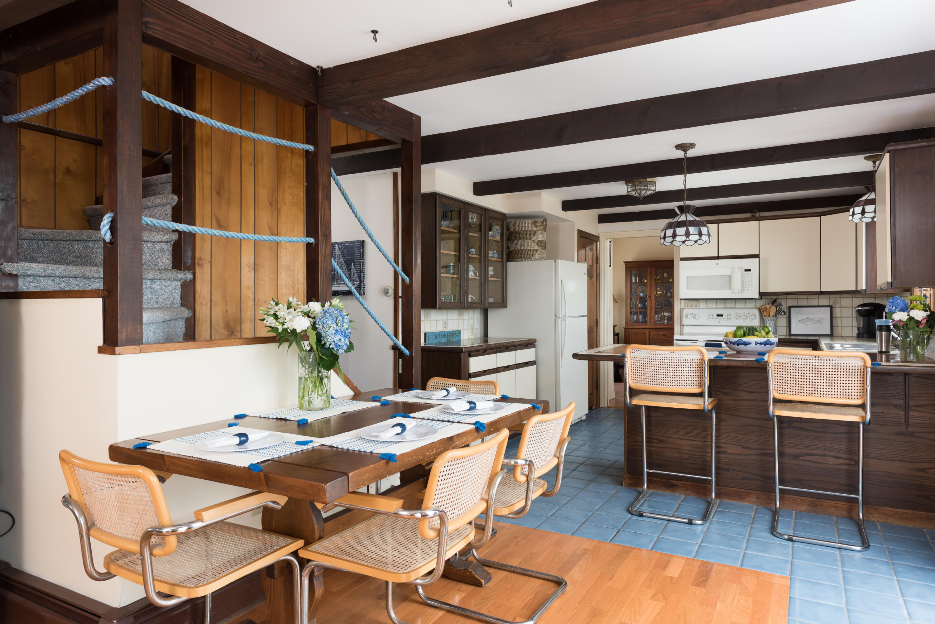 85 Sparrow Road Eastham, MA 02642 - Photo 23 of 43 a view of a dining room with furniture and a rug