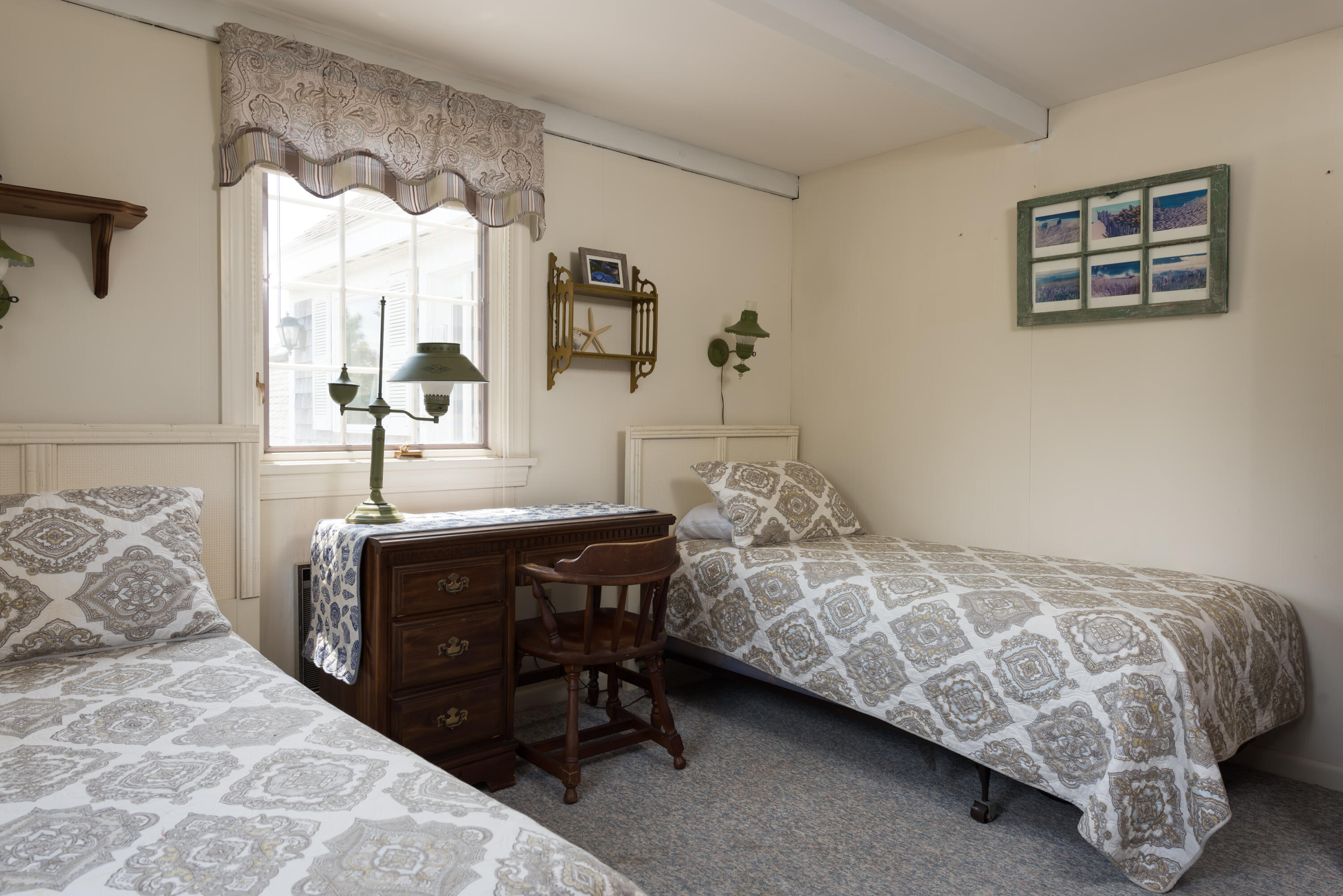85 Sparrow Road Eastham, MA 02642 - Photo 26 of 43 a bedroom with a bed and a table