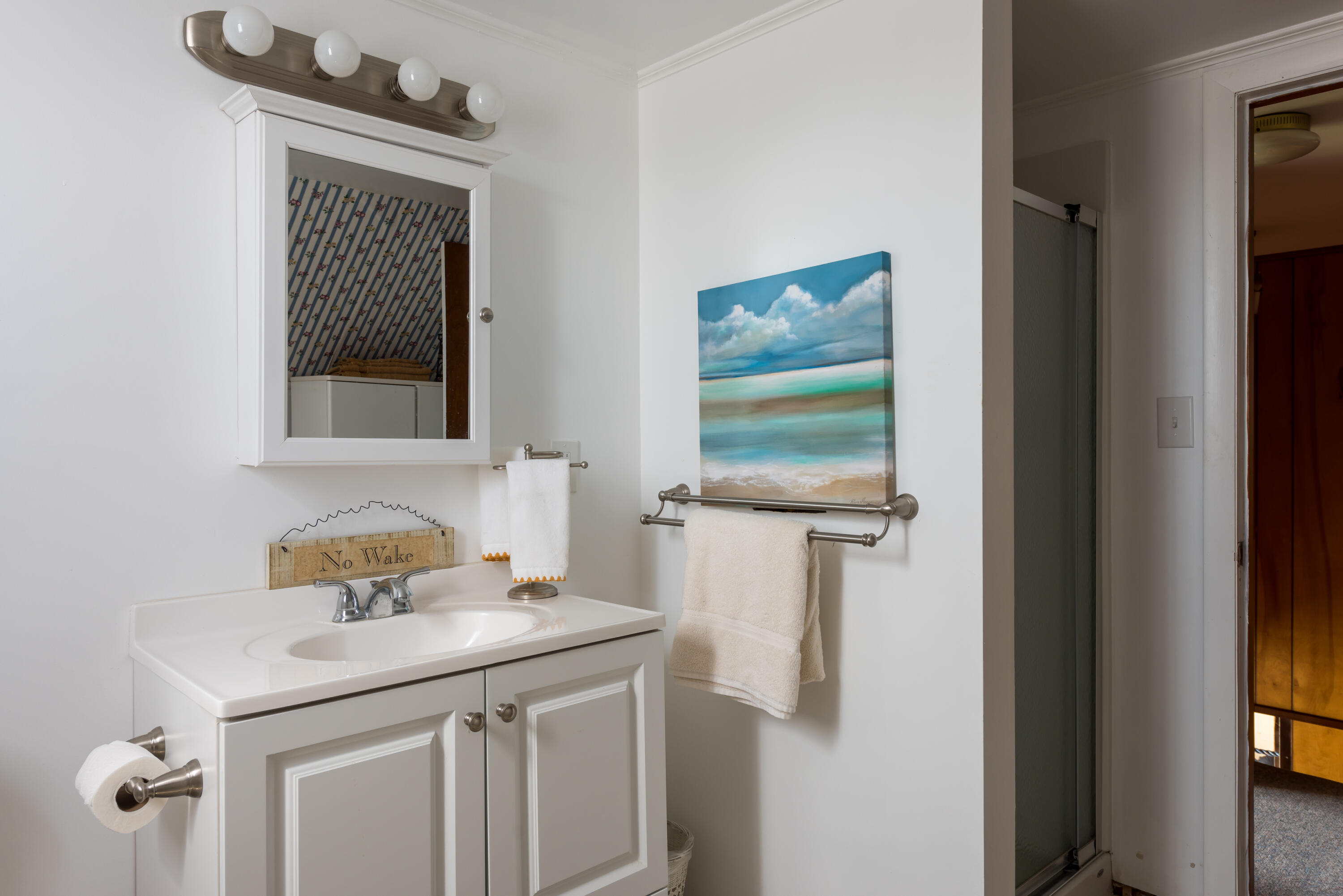 85 Sparrow Road Eastham, MA 02642 - Photo 29 of 43 a bathroom with a sink a mirror and a window