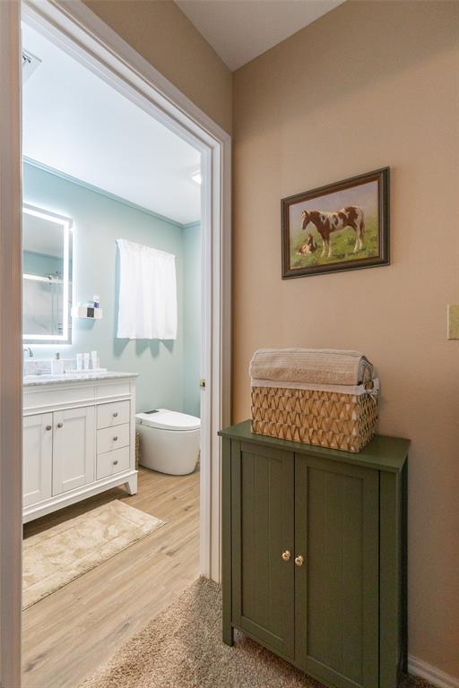 1603 Derrick Drive Haskell, TX 79521 - Photo 18 of 37 a spacious bathroom with a granite countertop sink mirror and bathtub