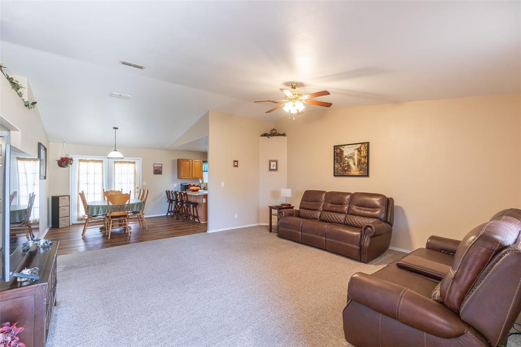 1603 Derrick Drive Haskell, TX 79521 - Photo 2 of 37 a living room with furniture and a chandelier