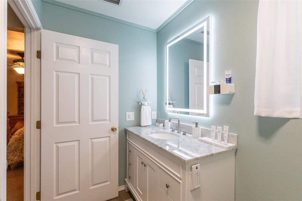 1603 Derrick Drive Haskell, TX 79521 - Photo 21 of 37 a bathroom with a sink and a mirror