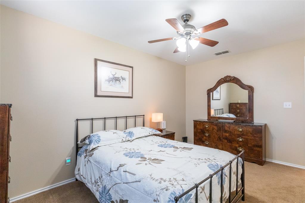 1603 Derrick Drive Haskell, TX 79521 - Photo 24 of 37 a bedroom with a bed and a dresser