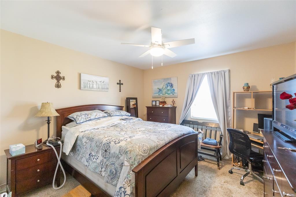 1603 Derrick Drive Haskell, TX 79521 - Photo 27 of 37 a bedroom with a bed and a bookshelf