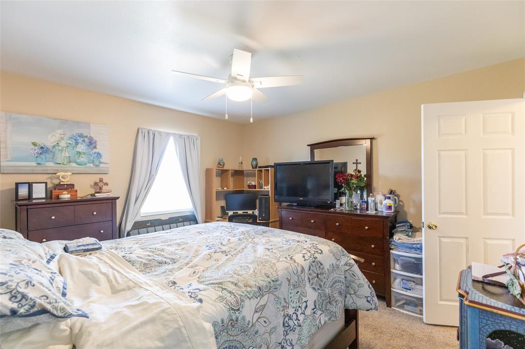 1603 Derrick Drive Haskell, TX 79521 - Photo 28 of 37 a bedroom with a bed and a flat screen tv